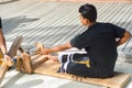 Maldivian worker in national clothes crafting souvenirs Royalty Free Stock Photo