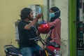 Maldivian young couple in masks at the street during corona virus pandemic