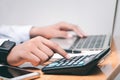 Male accountant making calculations,reviewing data in financial charts and graphs  at work place. Royalty Free Stock Photo