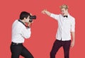 Male actor being photographed by paparazzi over red background