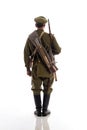 Male actor in the form of an ordinary soldier of the Russian army during the First World War posing against a white background in Royalty Free Stock Photo