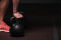 Male adult exercising with kettle bell in gym Royalty Free Stock Photo