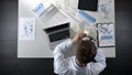 Male analyst doing observations of sample under microscope, lab research topview Royalty Free Stock Photo