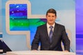 Male anchorman in tv studio. Live broadcasting Royalty Free Stock Photo
