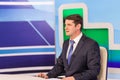 Male anchorman in tv studio. Live broadcasting Royalty Free Stock Photo