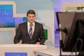 Male anchorman in tv studio. Live broadcasting