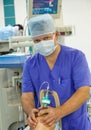 Male anesthesiologist working in operation room