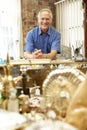 Male antique shop proprietor Royalty Free Stock Photo