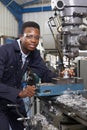 Male Apprentice Engineer Working On Drill In Factory Royalty Free Stock Photo