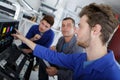 Male apprentices trying to repair office printer Royalty Free Stock Photo