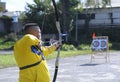 Male archer aiming at a mark on an archery shooting range