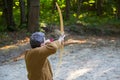 Male archer with wooden bow