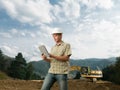 Male architect checking construction in progress Royalty Free Stock Photo