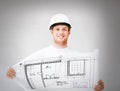 Male architect in helmet with blueprint Royalty Free Stock Photo