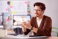 Male Architect In Office Working At Desk With Wooden Model Of Building Royalty Free Stock Photo