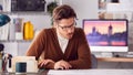 Male Architect In Office Working At Desk With Wooden Model Of Building Royalty Free Stock Photo