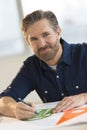 Male Architect Working On Blueprint At Desk Royalty Free Stock Photo