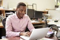 Male Architect Working At Desk On Laptop