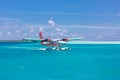 Male, Ari Atoll, Maldives - December 16. 2016: Seaplane of Trans Maldivian Airways landing in blue sea Royalty Free Stock Photo