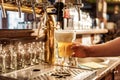 Male arm keeping pouring beer in alehouse Royalty Free Stock Photo