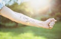 Male arm with text -I hate you- written in skin Royalty Free Stock Photo