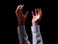 Male arms and hands raised and outstretched in the air to god. Man praying, begging, pleading imploring or supplicating. Royalty Free Stock Photo