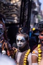 Male artist act as lord shiva with painted face during masaan holi in varanasi