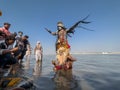 Male artist act as lord shiva with painted face during masaan holi in varanasi