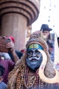 Male artist act as lord shiva with painted face during masaan holi in varanasi