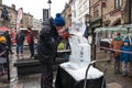 Male artist sculpting and ice scultpure