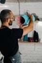 Male artist sculptor artisan creates a vase with his own hands in an art workshop