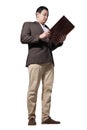 Male Asian businessman standing and holding document paper, full body length portrait isolated on white Royalty Free Stock Photo