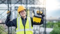 Male Asian mechanic carrying work tool at site Royalty Free Stock Photo