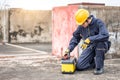 Male Asian mechanic preparing work tool at site Royalty Free Stock Photo