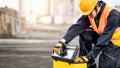 Male Asian mechanic preparing work tool at site Royalty Free Stock Photo