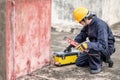 Male Asian mechanic preparing work tool at site Royalty Free Stock Photo