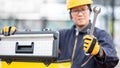 Male Asian mechanic preparing work tool at site Royalty Free Stock Photo