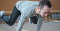 Man performing planche on parallel bars