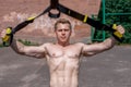 Male athlete close-up, trains nature in city, summer trx training, Feel your strength and balance, motivation, tanned
