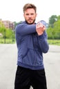 Male athlete doing stretch outside Royalty Free Stock Photo