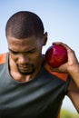 Male athlete holding shot put ball Royalty Free Stock Photo