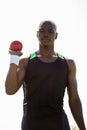 Male athlete holding shot put ball Royalty Free Stock Photo