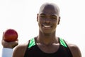 Male athlete holding shot put ball Royalty Free Stock Photo