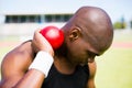 Male athlete holding shot put ball Royalty Free Stock Photo