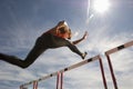 Male Athlete Jumping Hurdle Royalty Free Stock Photo