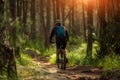 Male athlete mountainbiker rides a bicycle along a forest trail Royalty Free Stock Photo