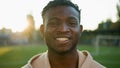 Male athlete portrait cheerful smiling ethnic young sportsman African American man athletic fit guy footballer runner Royalty Free Stock Photo