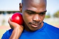 Male athlete preparing to throw shot put ball Royalty Free Stock Photo