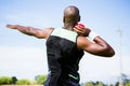 Male athlete preparing to throw shot put ball Royalty Free Stock Photo