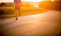 Male athlete/runner running on road